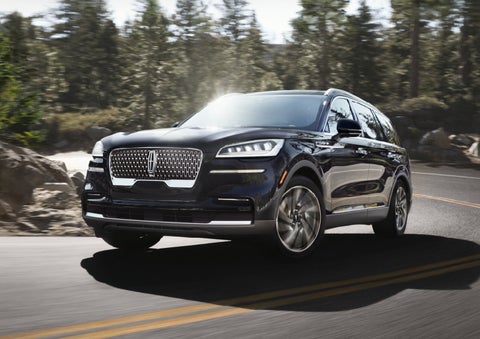 A Lincoln Aviator® SUV is being driven on a winding mountain road | Stivers Lincoln (AL) in Montgomery AL