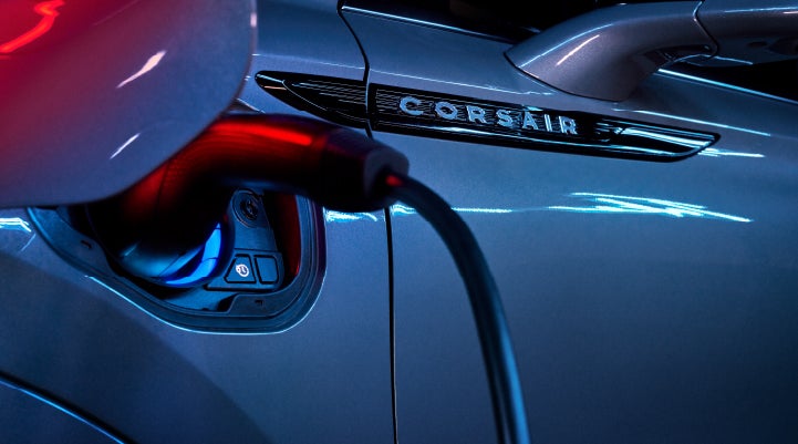A charger plugged into the charging port of a 2024 Lincoln Corsair® Plug-in Hybrid model. | Stivers Lincoln (AL) in Montgomery AL