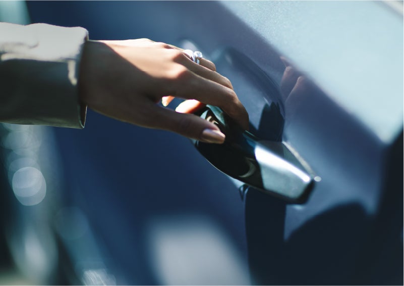 A hand gracefully grips the Light Touch Handle of a 2023 Lincoln Aviator® SUV to demonstrate its ease of use | Stivers Lincoln (AL) in Montgomery AL