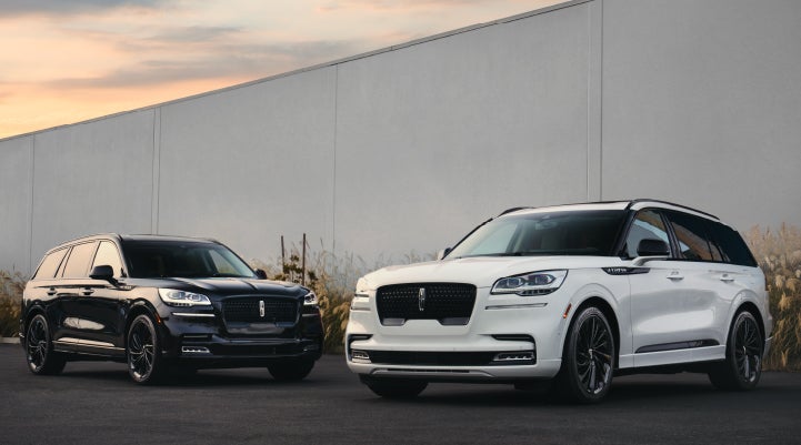 Two Lincoln Aviator® SUVs are shown with the available Jet Appearance Package | Stivers Lincoln (AL) in Montgomery AL