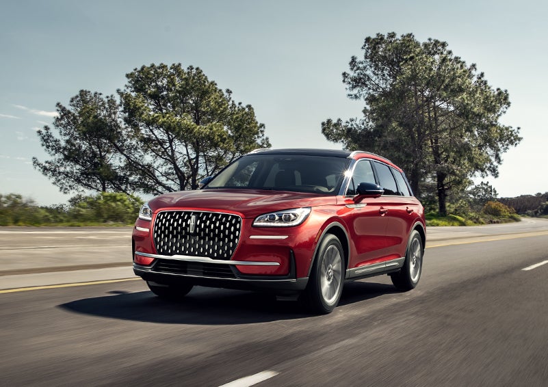 A 2024 Lincoln Corsair® SUV is shown being driven on a country road. | Stivers Lincoln (AL) in Montgomery AL