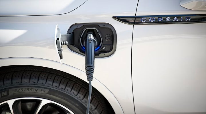 An electric charger is shown plugged into the charging port of a Lincoln Corsair® Grand Touring
model. | Stivers Lincoln (AL) in Montgomery AL