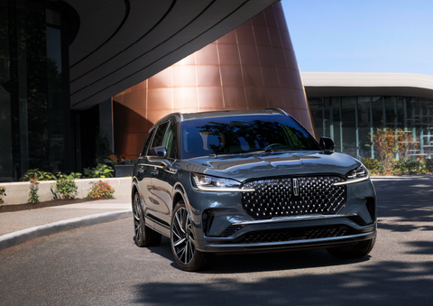 A gray 2025 Lincoln Aviator® SUV is parked outside a modern building with the sun shining. | Stivers Lincoln (AL) in Montgomery AL