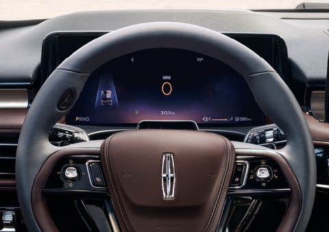The steering wheel of 2025 Lincoln Aviator® SUV is shown with black and brown accents. | Stivers Lincoln (AL) in Montgomery AL