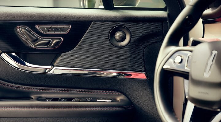 A Revel® audio speaker is shown in the driver's side door of a 2025 Lincoln Corsair® SUV. | Stivers Lincoln (AL) in Montgomery AL