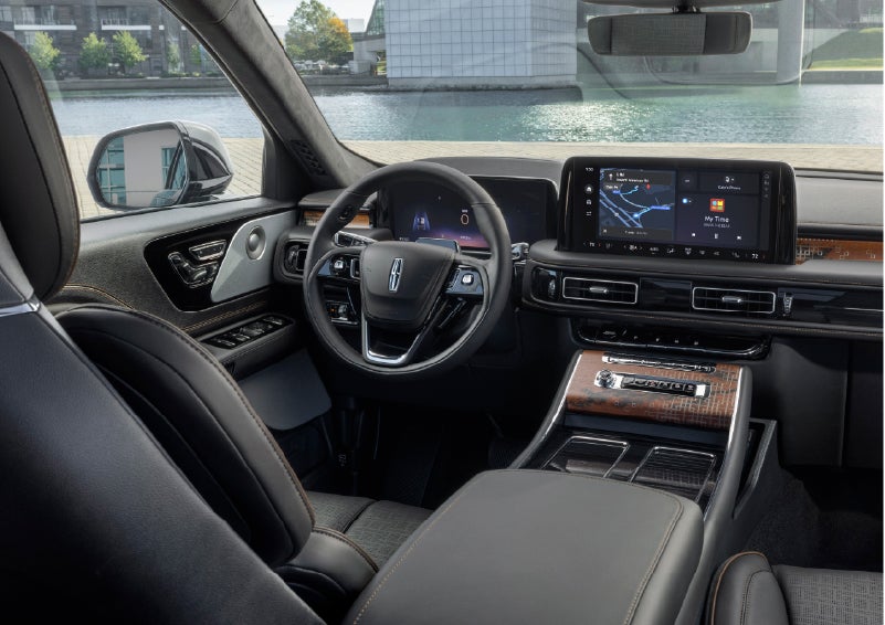 The interior of the 2026 Lincoln Aviator® SUV is shown parked with a view of a harbor through the windshield. | Stivers Lincoln (AL) in Montgomery AL