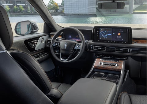 The interior of the 2026 Lincoln Aviator® SUV is shown parked with a view of a harbor through the windshield. | Stivers Lincoln (AL) in Montgomery AL