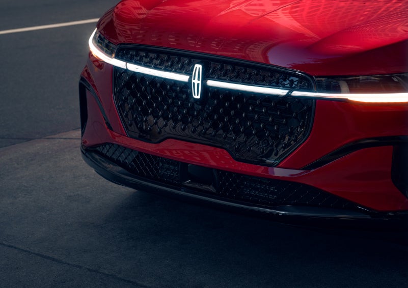 The available front LED light bar and center Lincoln Star logo glow at dusk. | Stivers Lincoln (AL) in Montgomery AL