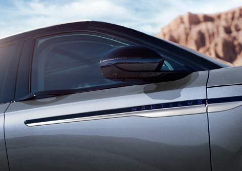 Blue lettering on the side of the vehicle that reads Nautilus indicates the available Hybrid Powertrain. | Stivers Lincoln (AL) in Montgomery AL