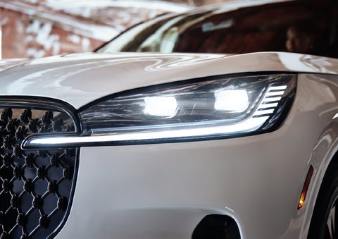 A close-up of a headlamp on the 2027 Lincoln Aviator® SUV is shown. | Stivers Lincoln (AL) in Montgomery AL