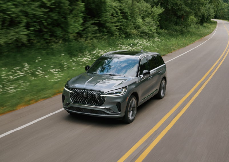 A 2027 Lincoln Aviator® SUV is being driven down a road. | Stivers Lincoln (AL) in Montgomery AL