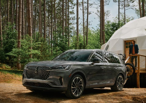 A 2027 Lincoln Aviator® is parked next to a high end glamping site. | Stivers Lincoln (AL) in Montgomery AL