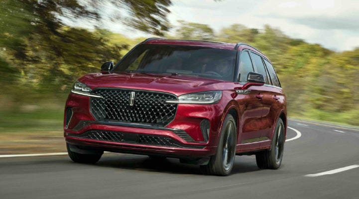 A 2027 Lincoln Aviator® SUV is being driven on a country road | Stivers Lincoln (AL) in Montgomery AL