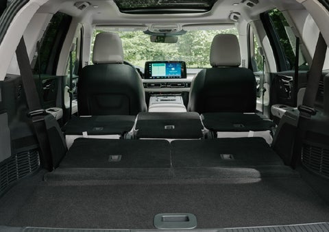 A rear to front view of the interior of a 2027 Lincoln Aviator® Black Label™ SUV shows the third and second rows folded flat | Stivers Lincoln (AL) in Montgomery AL