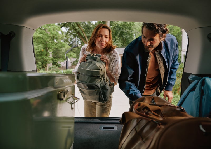 A couple loads luggage into the rear of a 2027 Lincoln Aviator® Black Label™ SUV..e 202 | Stivers Lincoln (AL) in Montgomery AL
